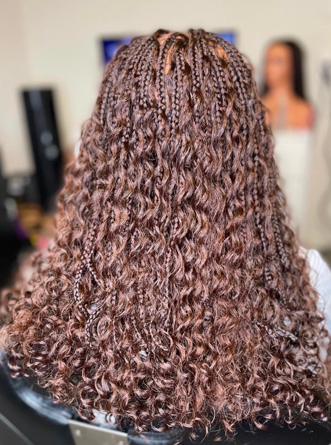 Braids with soft curl texture, finished in the studio